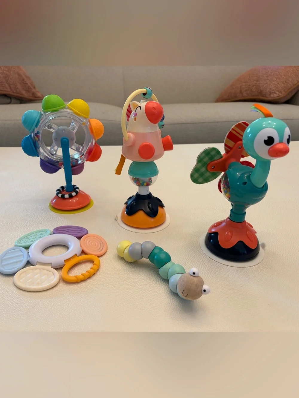 infant toy bundle including rattle and suction spinners
